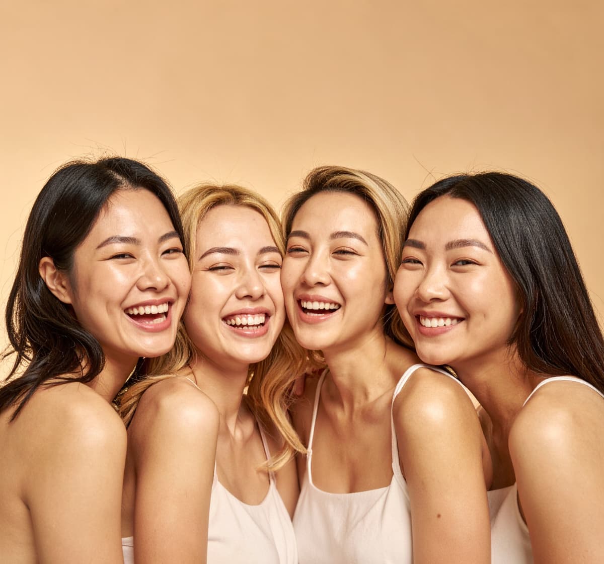 Four smiling women together